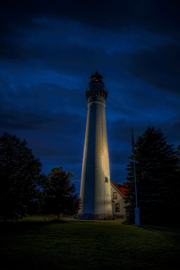 Windpoint Lighthouse After Dark Photograph by Dale Kauzlaric