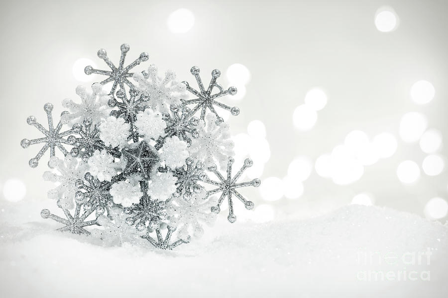Winter snowflake decoration on glitter background. Photograph by Michal Bednarek