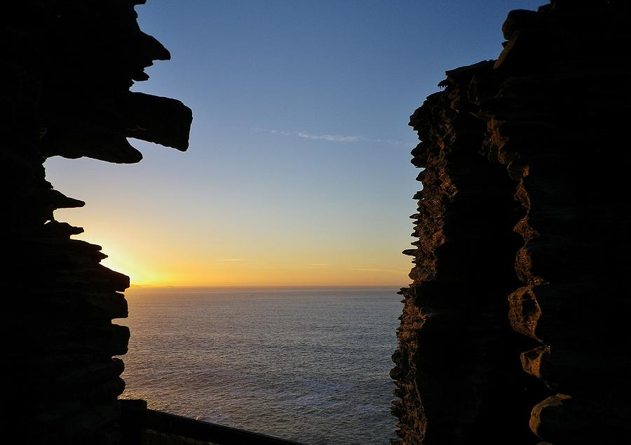 Winter Sunset At Tintagel Castle Cornwall Photograph by Richard Brookes