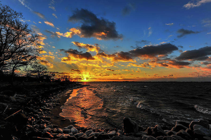 Winter sunset on a Chesapeake Bay beach Photograph by Patrick Wolf