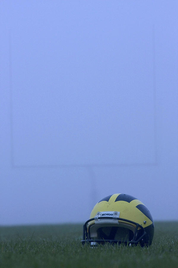 Wolverine helmet on the field in heavy fog by Michigan Helmet Wolverine helmet on the field in heavy fog by Michigan Helmet