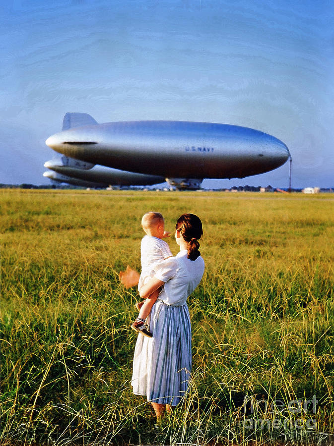 Woman and Child pearing at a row of Navy Blimps Photograph by Wernher Krutein
