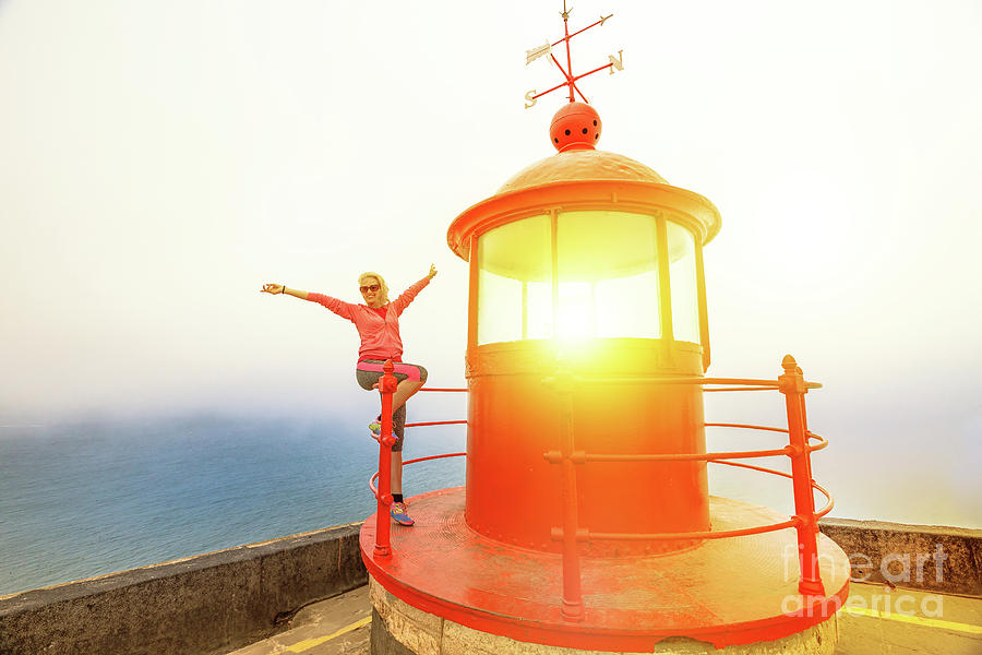 Woman at Nazare Lighthouse Photograph by Benny Marty