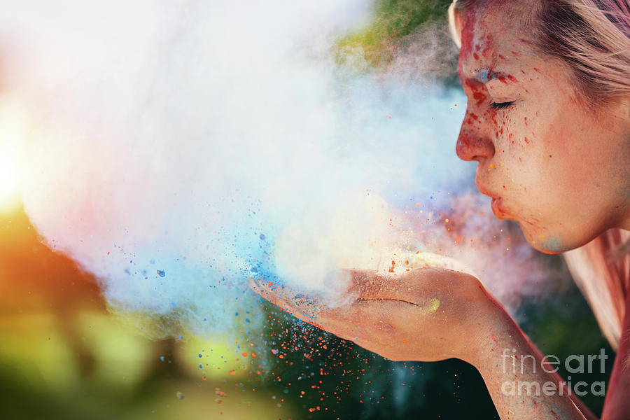 Woman blowing colorful holi powder Photograph by Michal Bednarek