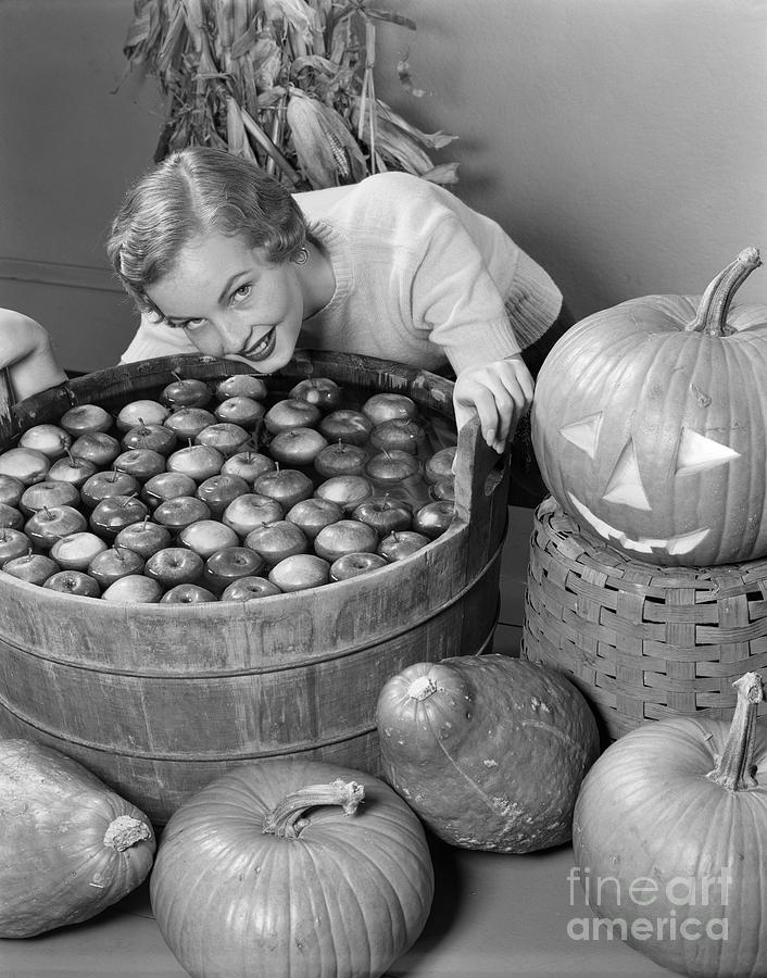 Woman Bobbing For Apples, C.1950s Photograph by H. Armstrong Roberts/ClassicStock