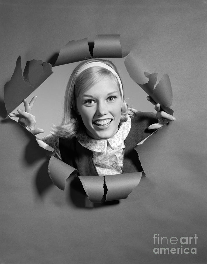 Woman Breaking Through Paper, C.1960s Photograph by H. Armstrong Roberts/ClassicStock