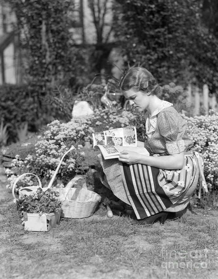 Woman Consulting Gardening Book Photograph by H. Armstrong Roberts/ClassicStock