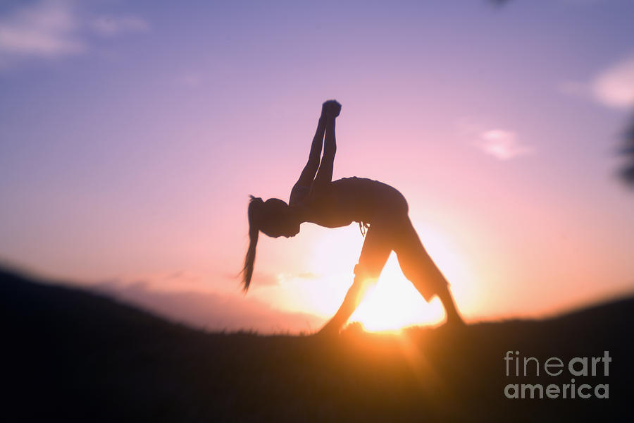 Woman doing yoga at sunset Photograph by Ron Dahlquist - Printscapes