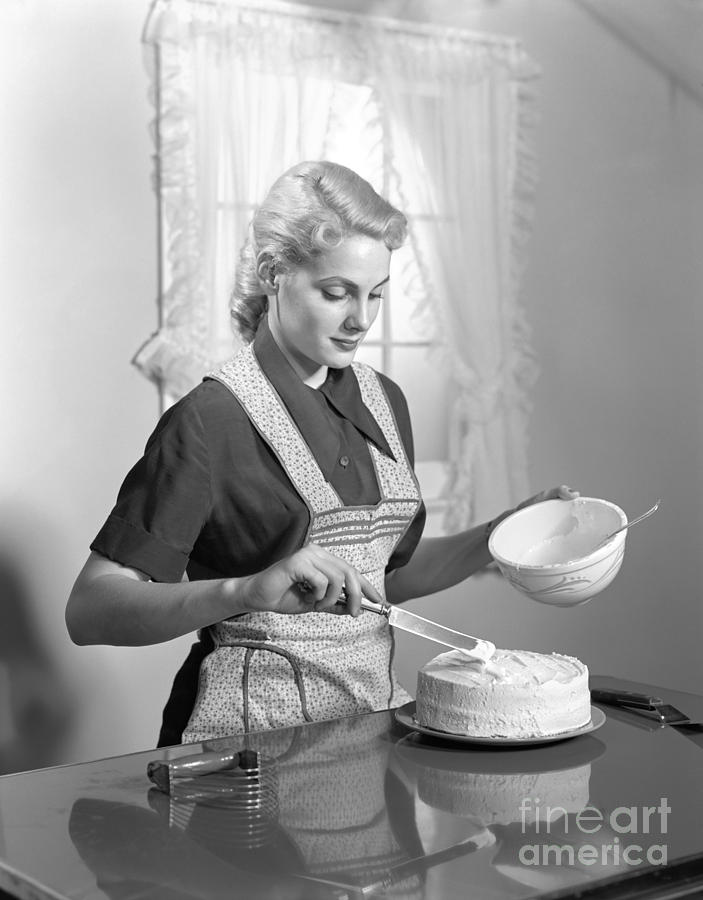 Cake Photograph - Woman Frosting A Cake, C.1940s by H. Armstrong Roberts/ClassicStock