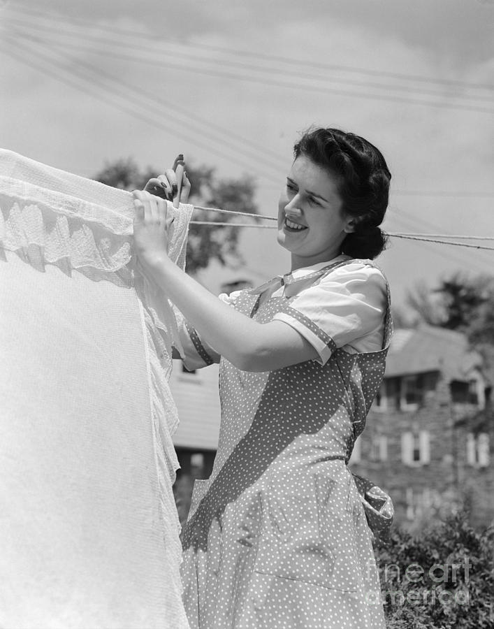 Woman Hanging Laundry Out To Dry Photograph by H. Armstrong Roberts/ClassicStock