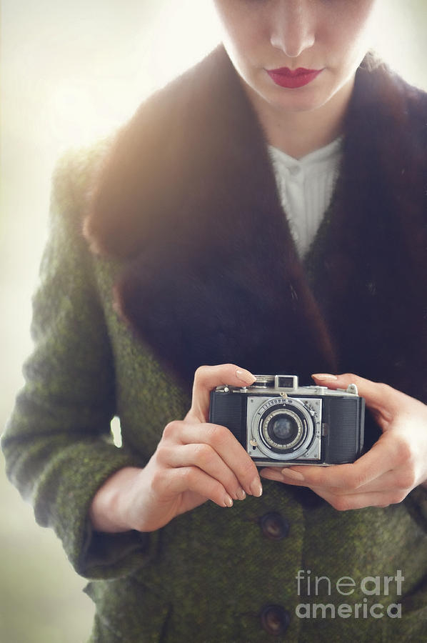 Woman Holding A Vintage 35mm Camera  Photograph by Lee Avison
