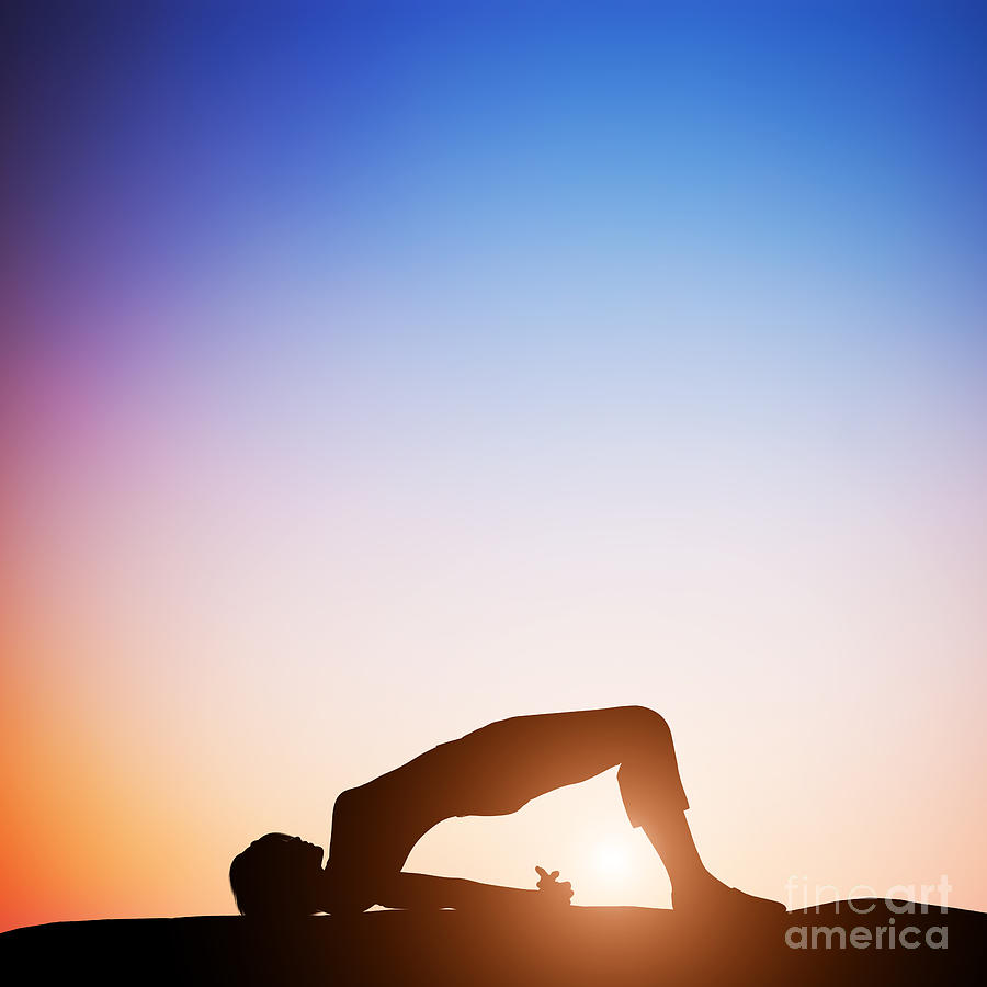 Woman in bridge yoga pose meditating at sunset Photograph by Michal Bednarek