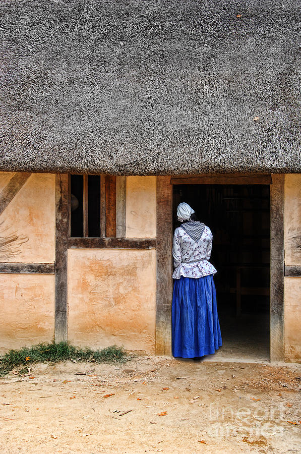 Woman in Doorway of a Thatched Roof Cottage Photograph by Jill Battaglia