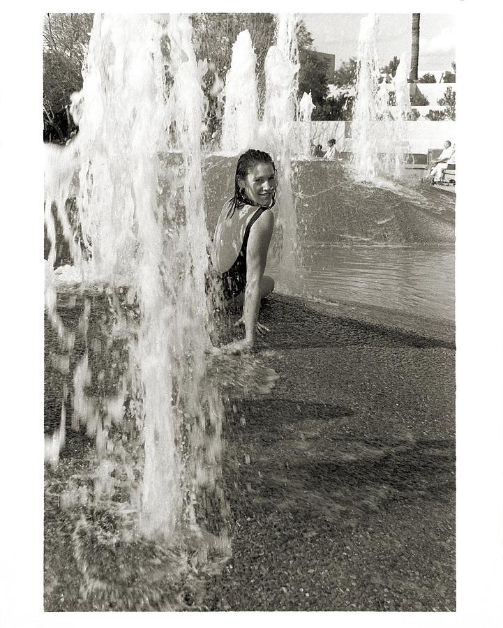 Woman in Fountain Photograph by Laura Smith