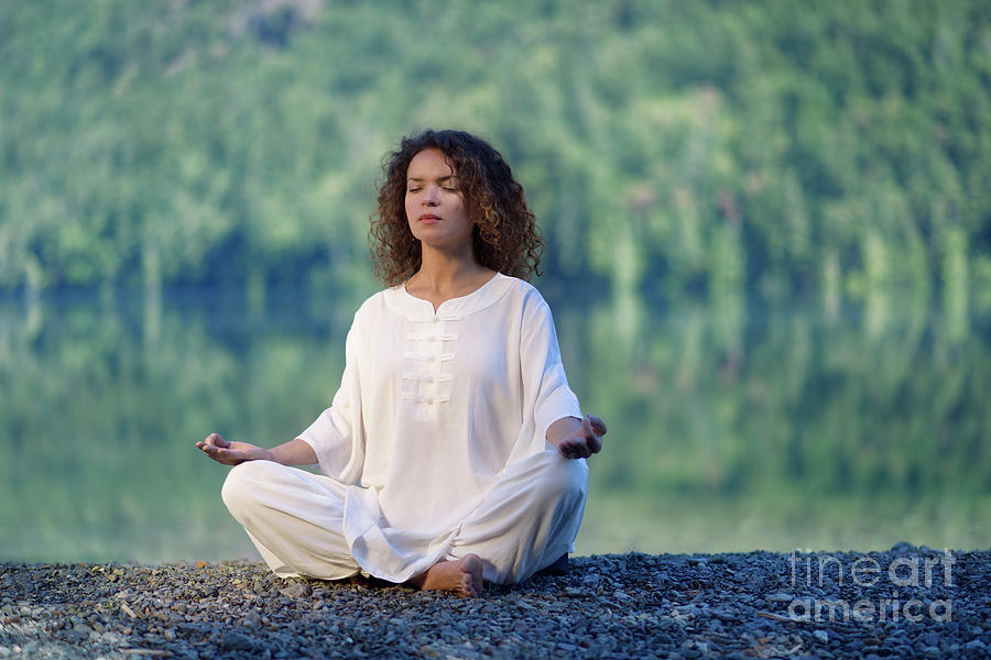 Woman in white clothes meditating in the morning sunrise by the Photograph  by Awen Fine Art Prints - Pixels