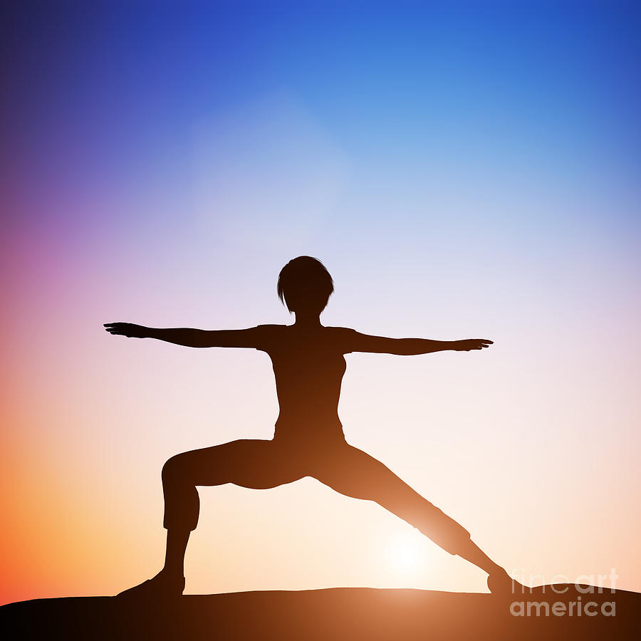 Woman in worrior yoga pose meditating at sunset Photograph by Michal Bednarek