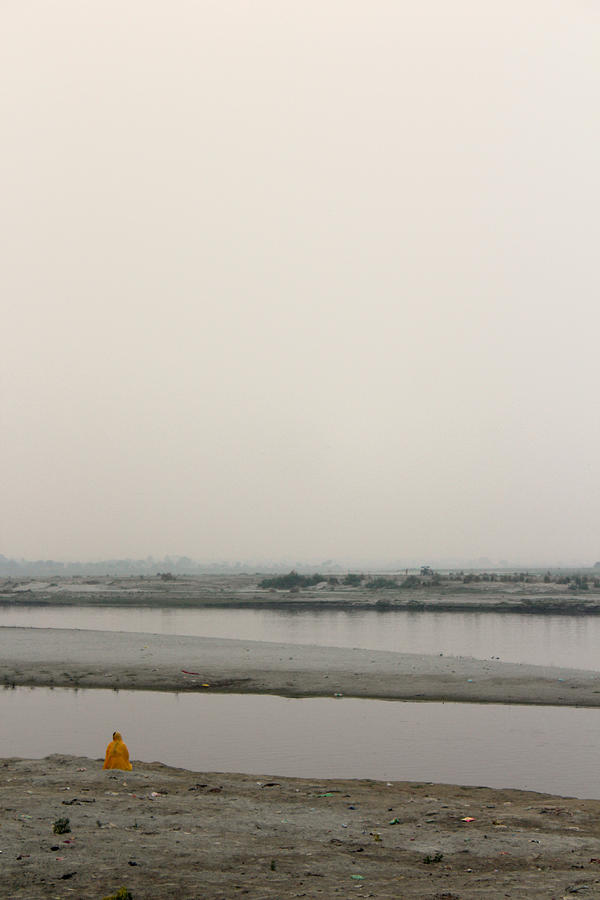 Woman in Yellow Sari Sitting at the Yamuna River, Vrindavan Photograph by Jennifer Mazzucco