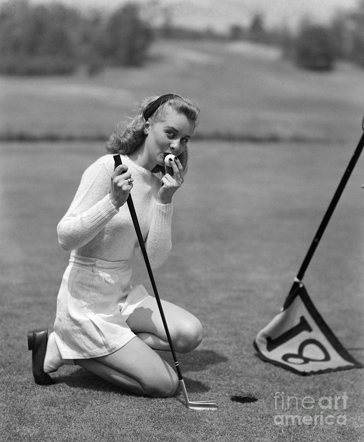 Woman Kissing Golf Ball, C.1950s Photograph by Debrocke/ClassicStock