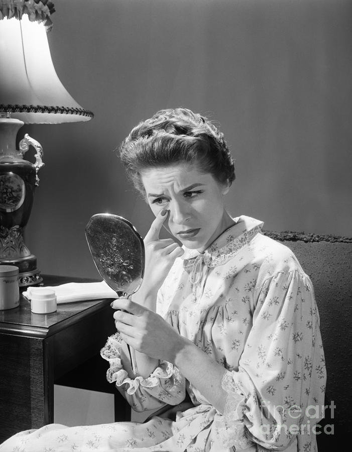 Woman Looking At Eye Wrinkles Photograph by Debrocke/ClassicStock