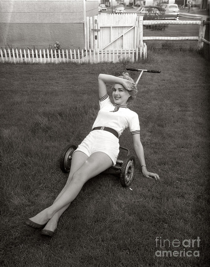 Woman Lounging On Lawnmower, C.1950s Photograph by Debrocke/ClassicStock