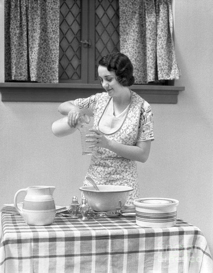 Woman Pouring Milk Into Measuring Cup Photograph by H. Armstrong Roberts/ClassicStock