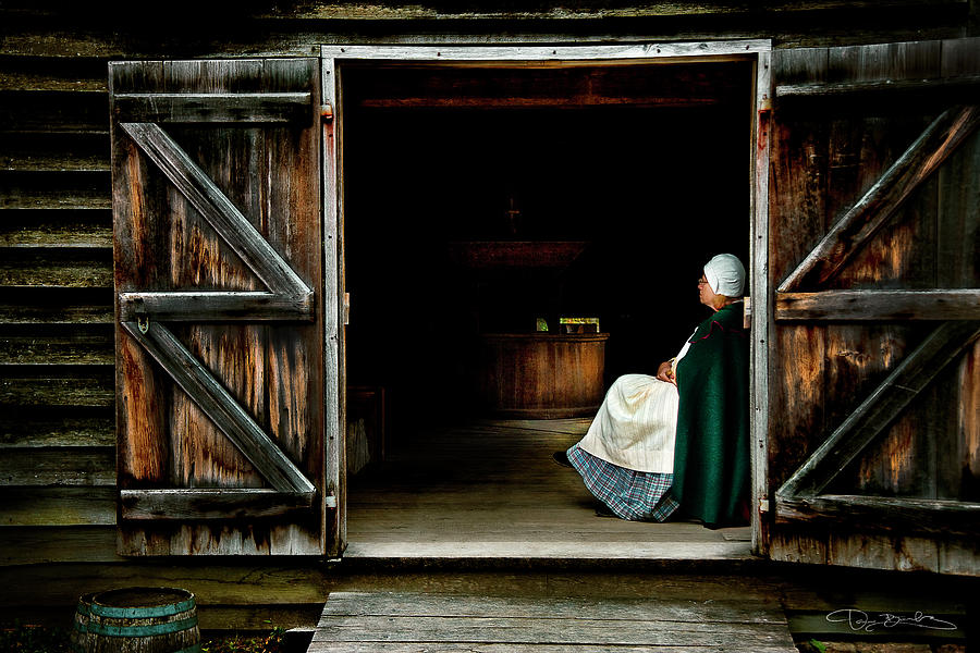 Woman Sitting In Old Barn Entrance Photograph by Dan Barba