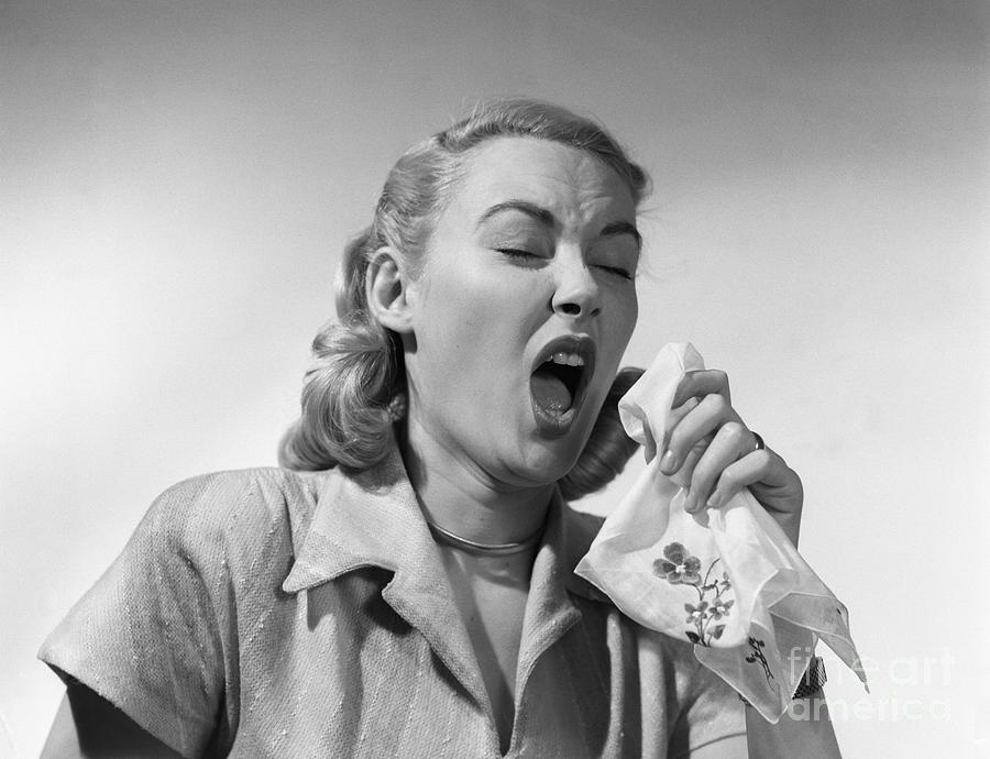 Woman Sneezing Into A Handkerchief Photograph by Debrocke/ClassicStock