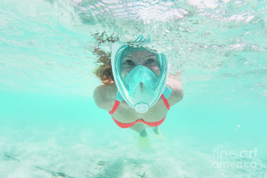 Woman snorkeling underwater in Indian Ocean, Maldives Photograph by Michal Bednarek