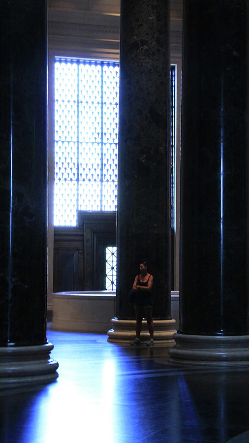 Woman Standing In The Dark With Tall Dark Columns Photograph by Cora Wandel