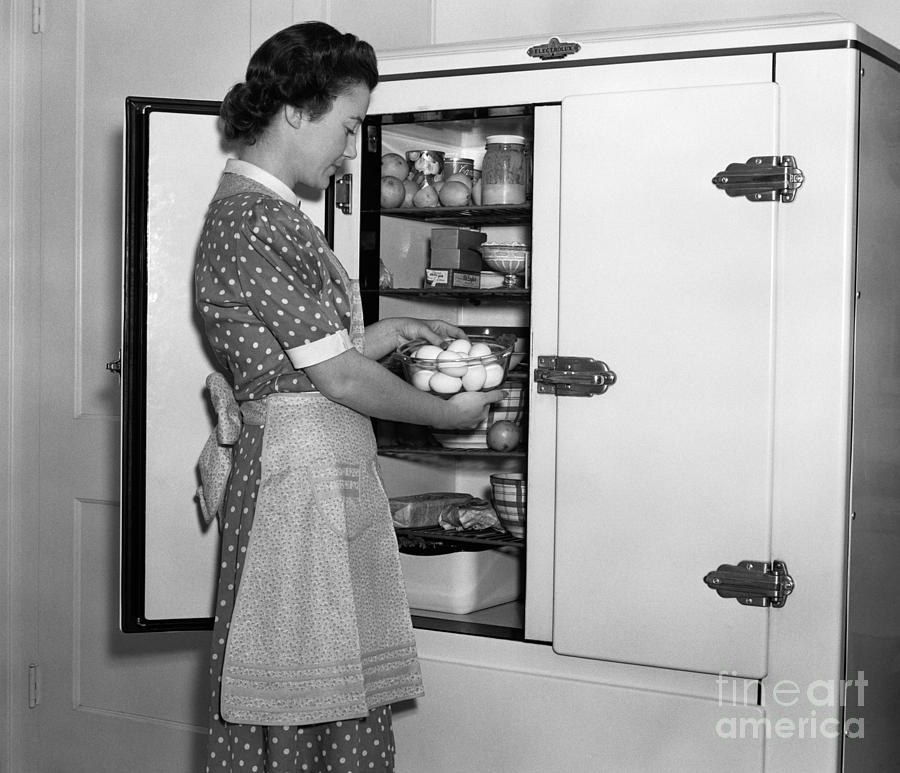 Woman Taking Eggs From Icebox, C.1930s Photograph by H. Armstrong Roberts/ClassicStock