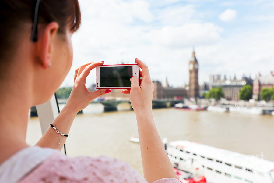 Woman taking pictures of Big Ben, London UK with smartphone, mobile Photograph by Michal Bednarek
