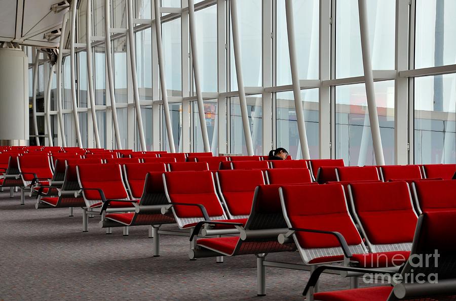 Woman traveler sleeps at Hong Kong International Airport Photograph by Imran Ahmed