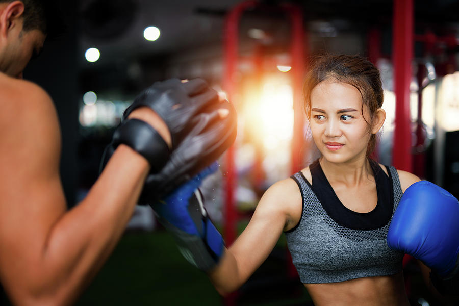 Woman ttaining for Fitness boxing Photograph by Anek Suwannaphoom