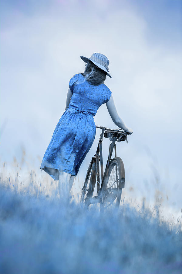 Woman with bicycle in field Photograph by Maggie Mccall
