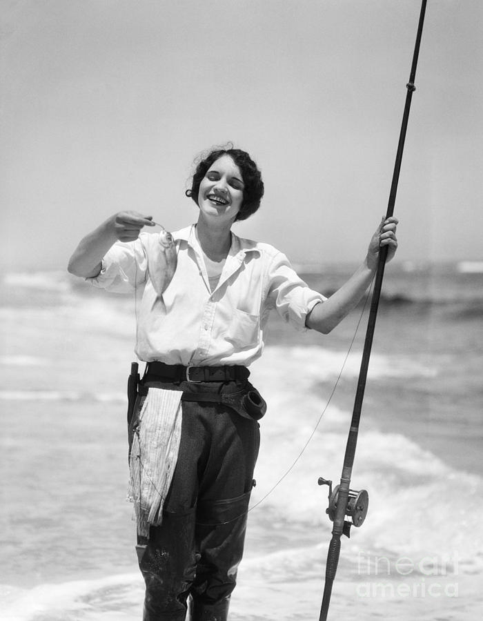 Woman With Freshly Caught Fish Photograph by H. Armstrong Roberts/ClassicStock