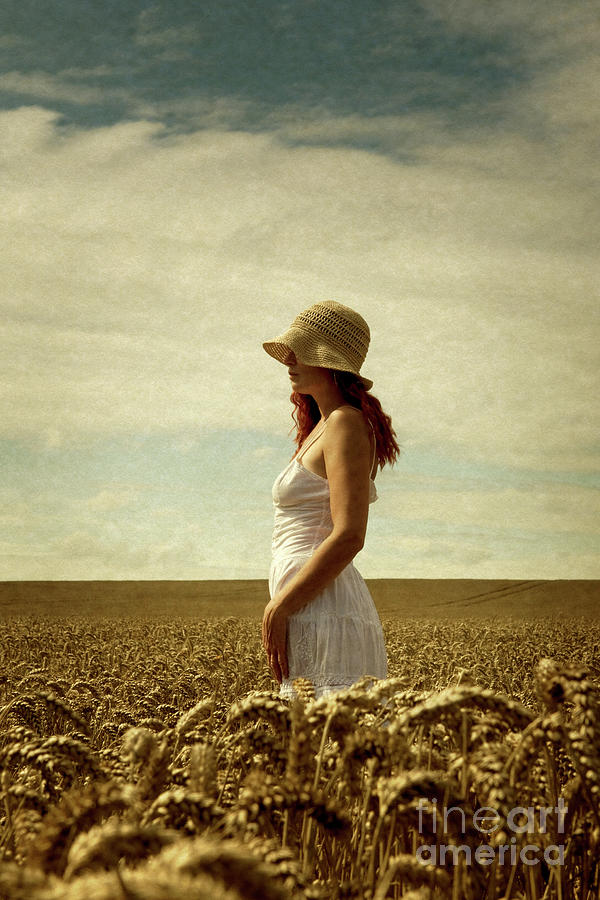 Woman with sun hat in corn field Photograph by Clayton Bastiani