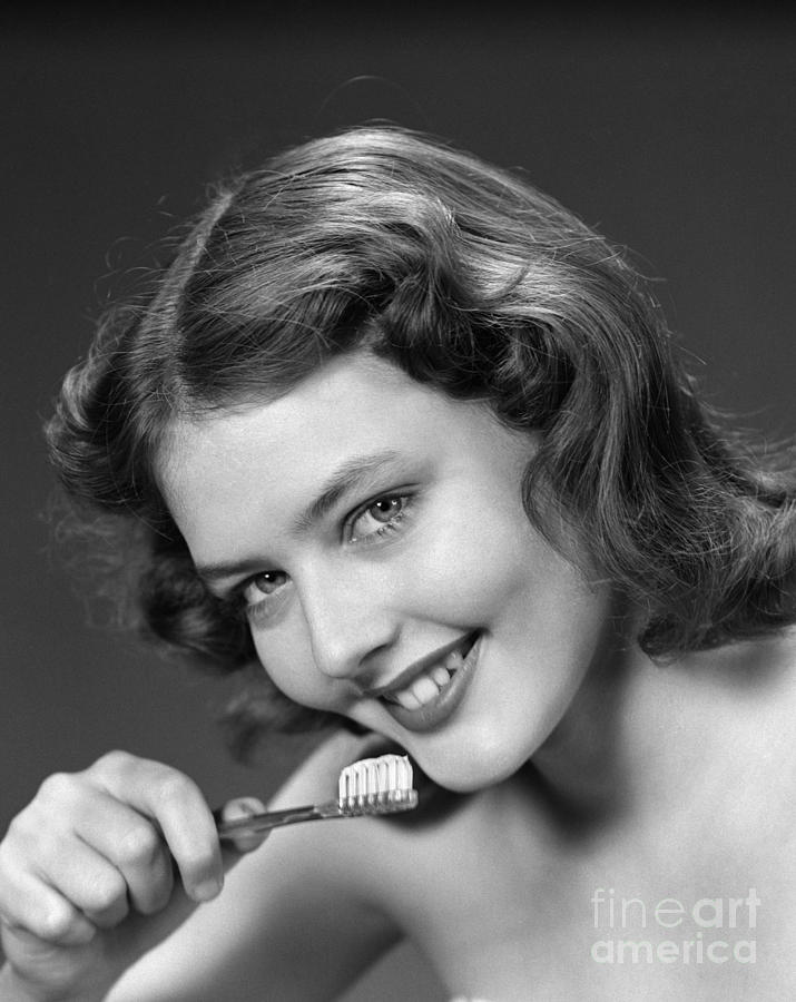 Woman With Toothbrush, C.1940-50s Photograph by H. Armstrong Roberts/ClassicStock