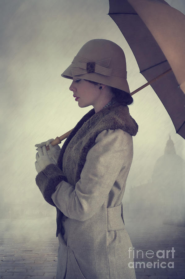 Woman With Vintage Cloche Hat Overcoat And Umbrella In Rain Photograph by Lee Avison