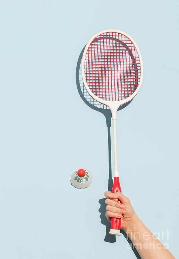 Womans hand holding a retro badminton racket Photograph by Michal Bednarek