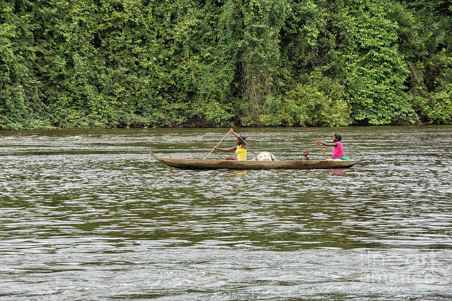 Women and child in canoe Photograph by Patricia Hofmeester