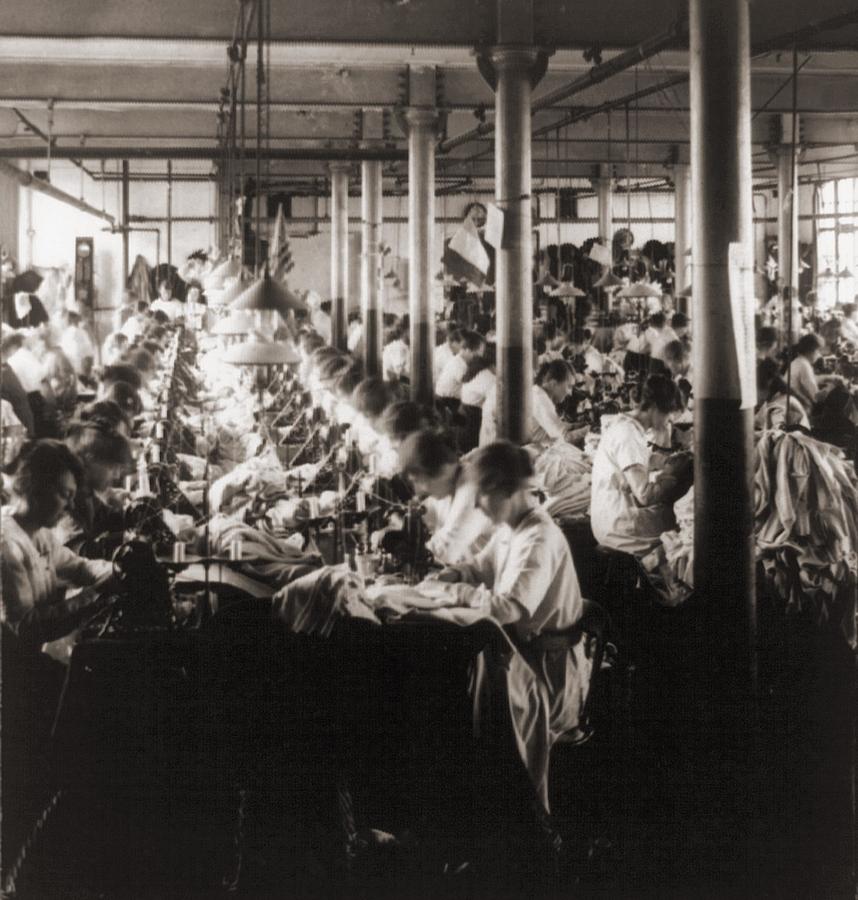 Women Working At Sewing Machines Photograph by Everett