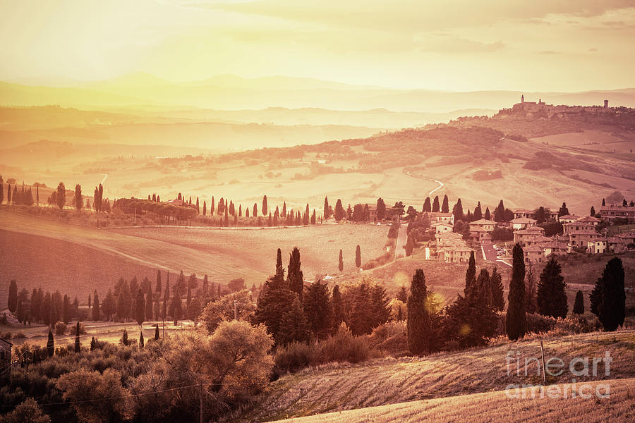 Wonderful Tuscany landscape with cypress trees, farms and small medieval towns, Italy. Vintage sunset Photograph by Michal Bednarek