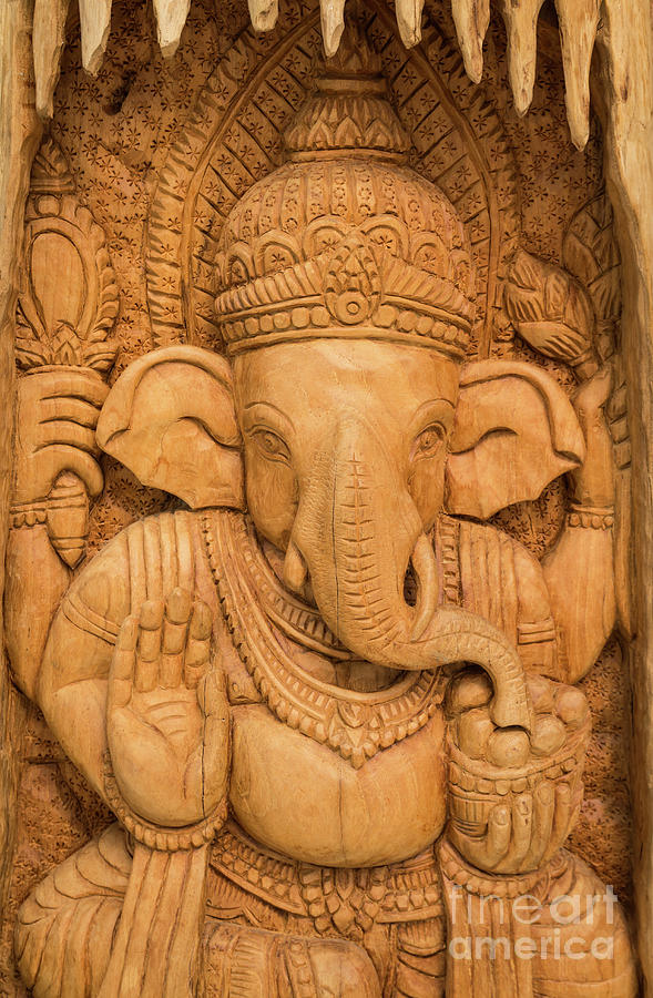 wood carving for Hindu god Ganesha on the wood. Photograph by Tosporn Preede