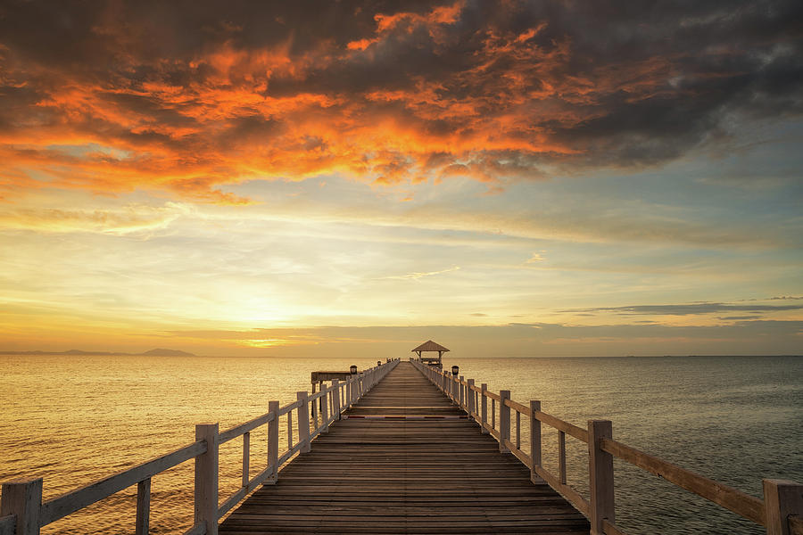 Wooded bridge with sunset Photograph by Anek Suwannaphoom