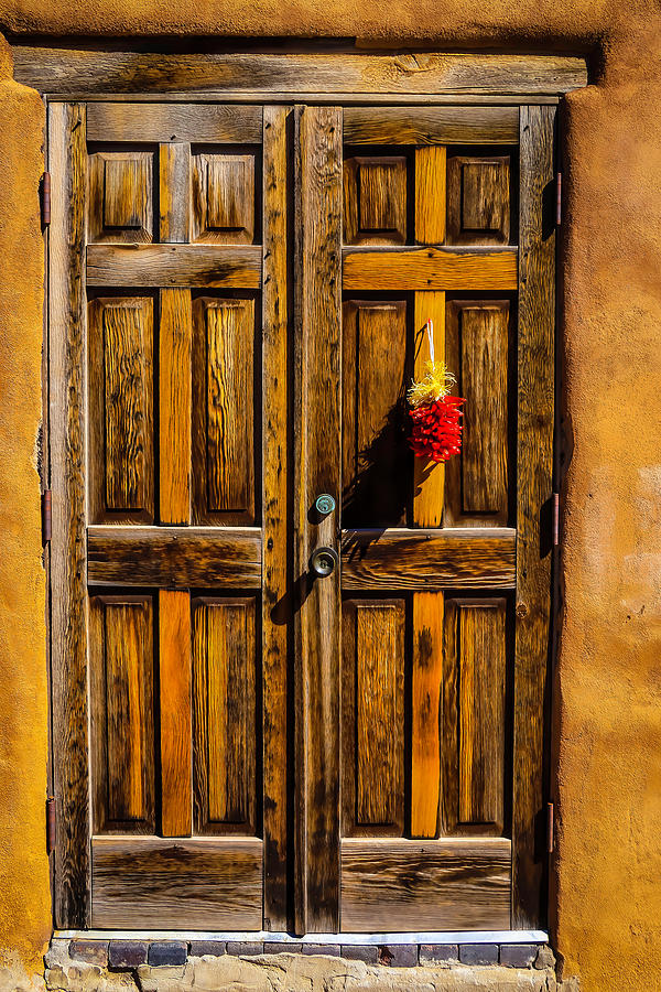Wooden Door With Red Chiiles Photograph by Garry Gay