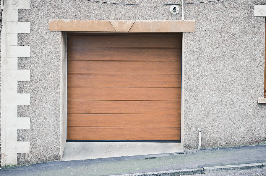 Wooden garage door Photograph by Tom Gowanlock