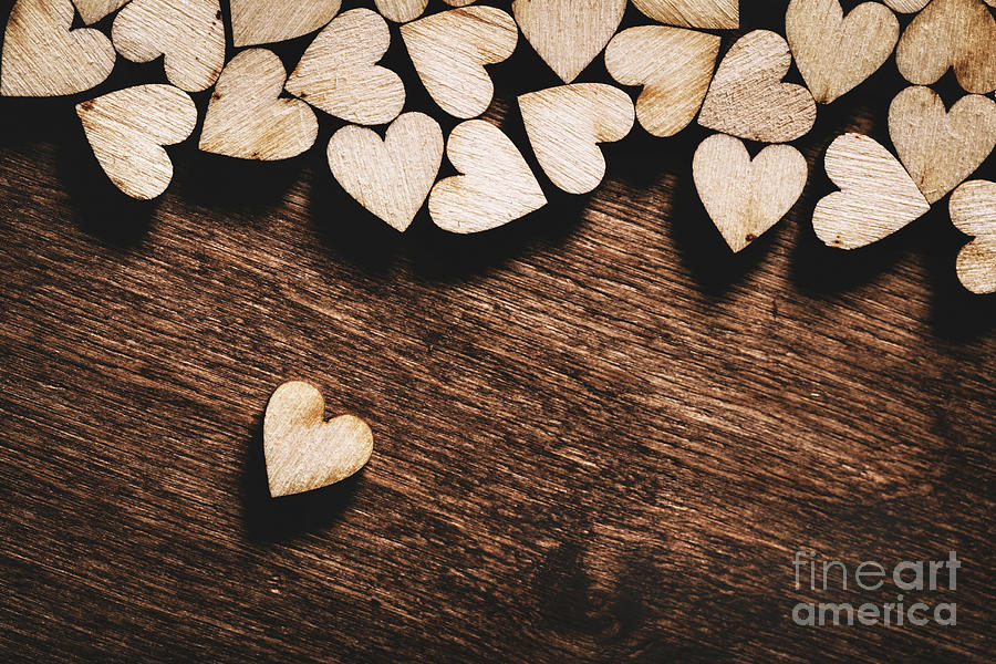 Wooden hearts on dark wooden background Photograph by Michal Bednarek
