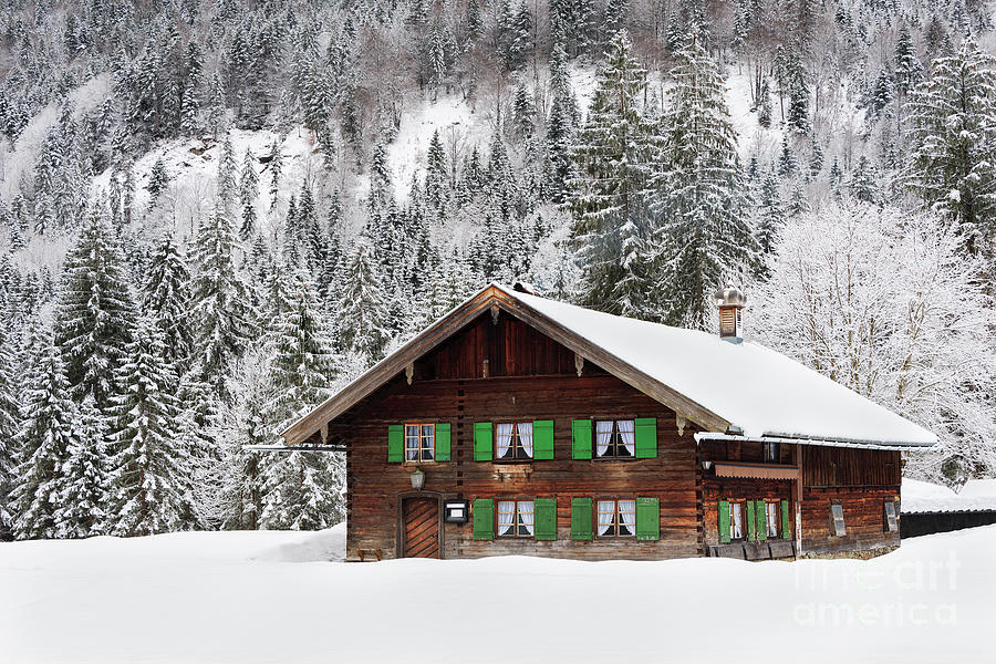 Winter Photograph - Wooden house in Bavaria in the snow by IPics Photography