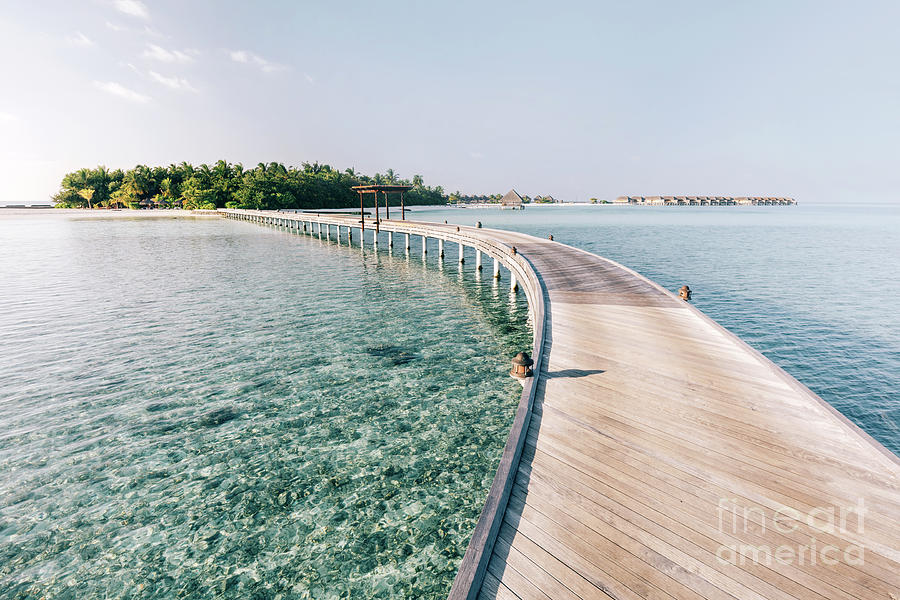 Wooden jetty leading to a tropical island Photograph by Michal Bednarek