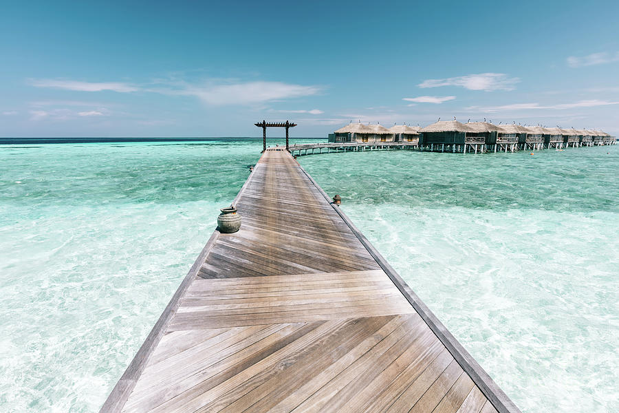 Wooden jetty on Maldives. Holiday travel destination. Photograph by Michal Bednarek